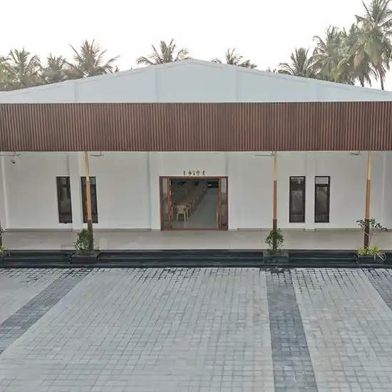 Drone view highlighting the large wedding hall structure, open spaces, and well planned layout