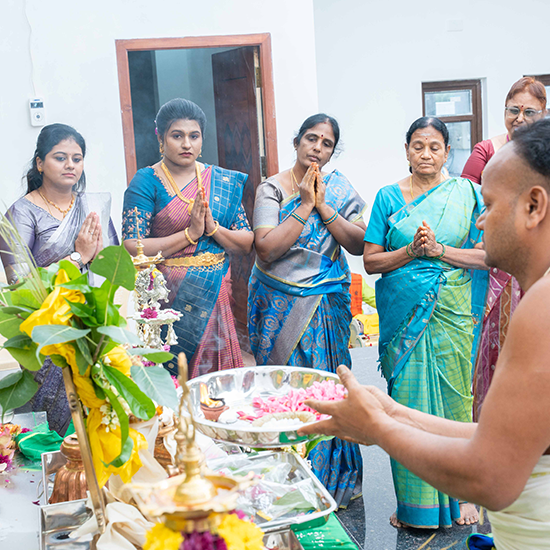 Families performing prayer rituals at the mahal seeking divine blessings and harmony before celebrations