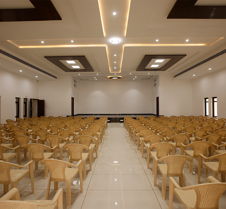 Spacious wedding stage view featuring elegant decoration, lighting, and setup for ceremonial moments