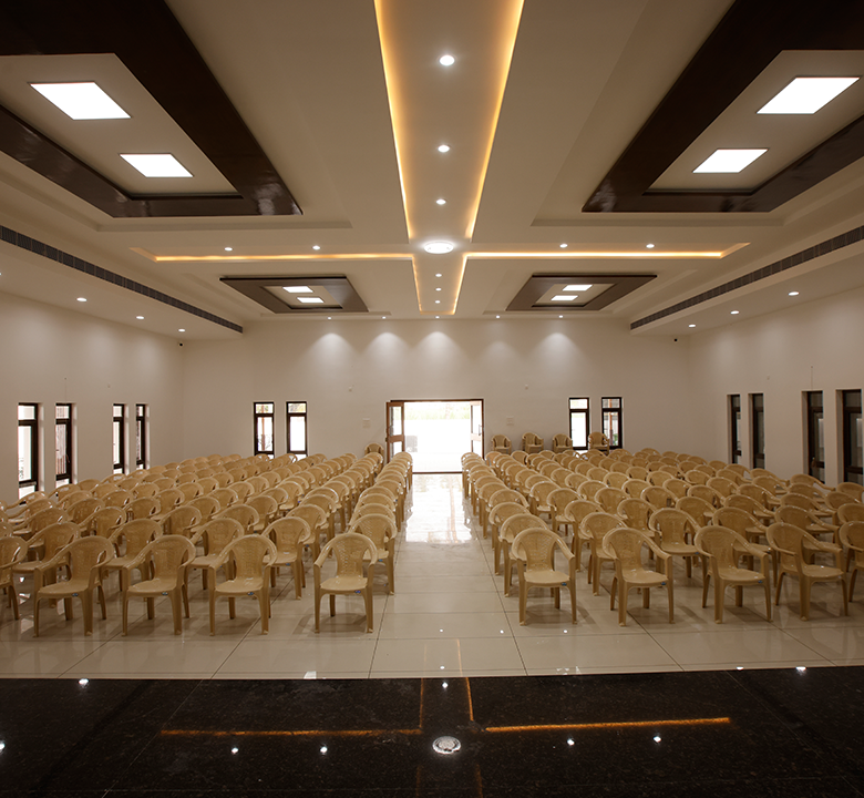 Spacious interior hall view showcasing seating arrangement, lighting, and decor for large celebrations